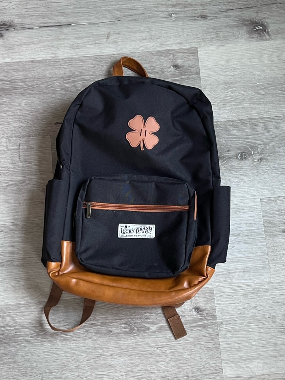 Lucky Brand Black and Tan Backpack with Pink Clover Accent